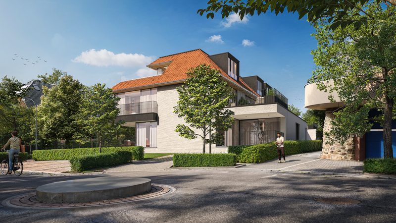 Zijgevel van de residentie met dakkapellen en bomen langs de weg